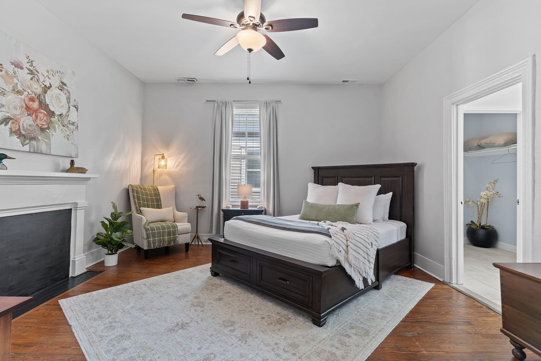 Bedroom with historic fireplace in the Live Oak Suite at Third & Oak, downtown Wilmington NC